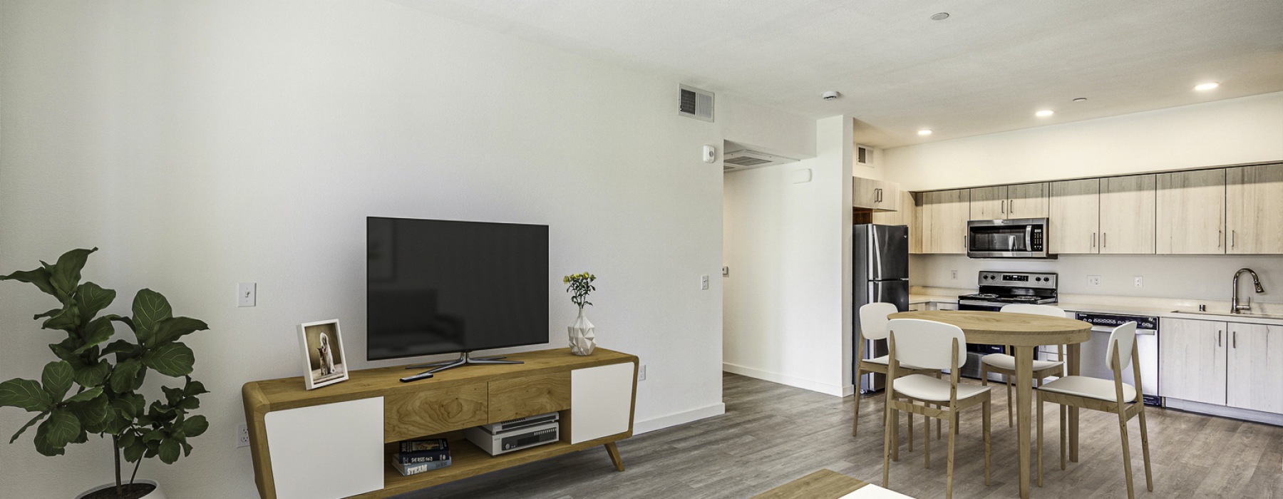 Living room with table and large TV