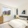 bedroom with queen bed and dresser