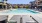 Apartments in Brentwood, CA for Rent - Blossoms at Brentwood - Blue Pool with Gate and Poolside Seating